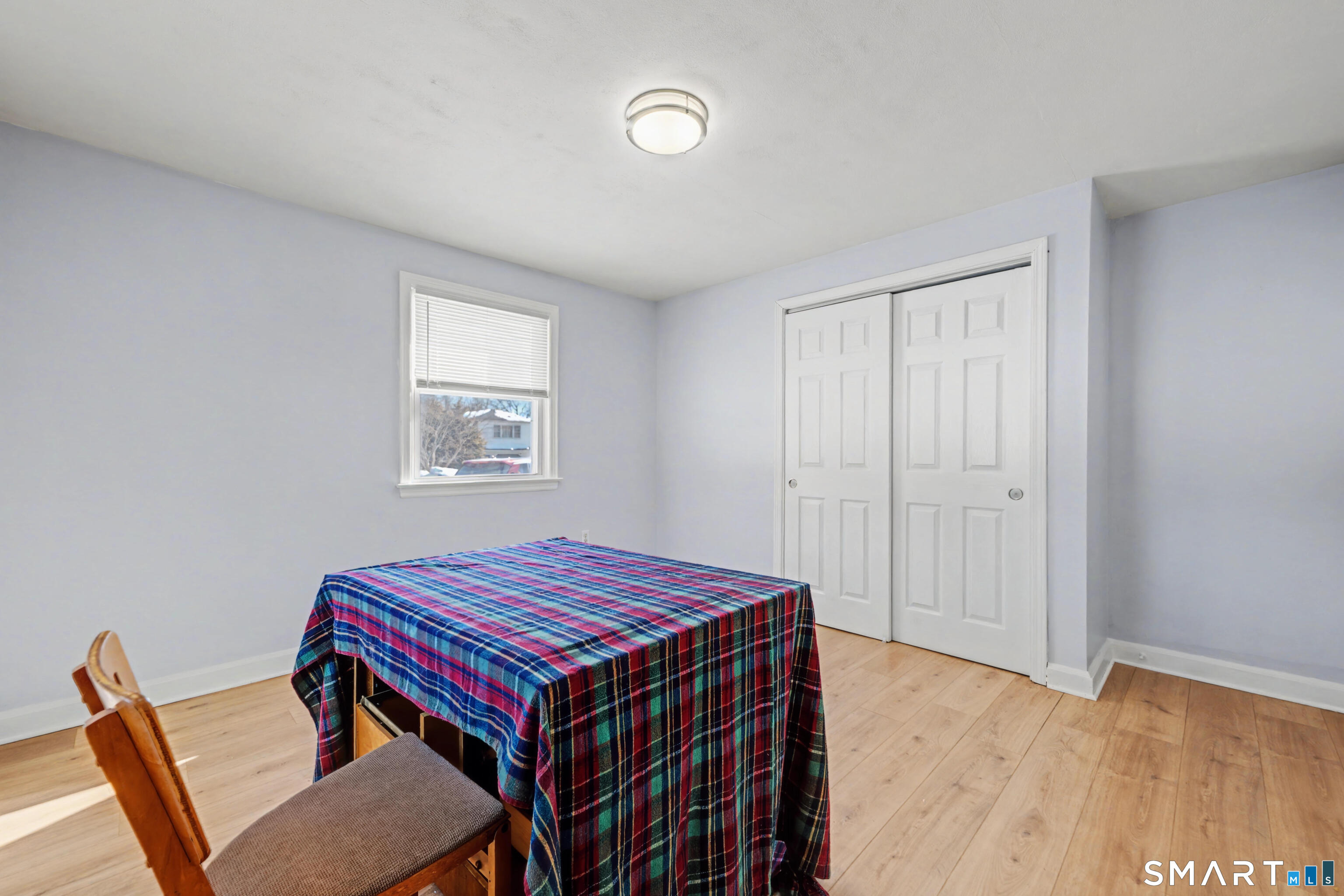 101 Pool Road North Haven, CT 06473 - Photo 21 of 37 a bedroom with a bed and wooden floor