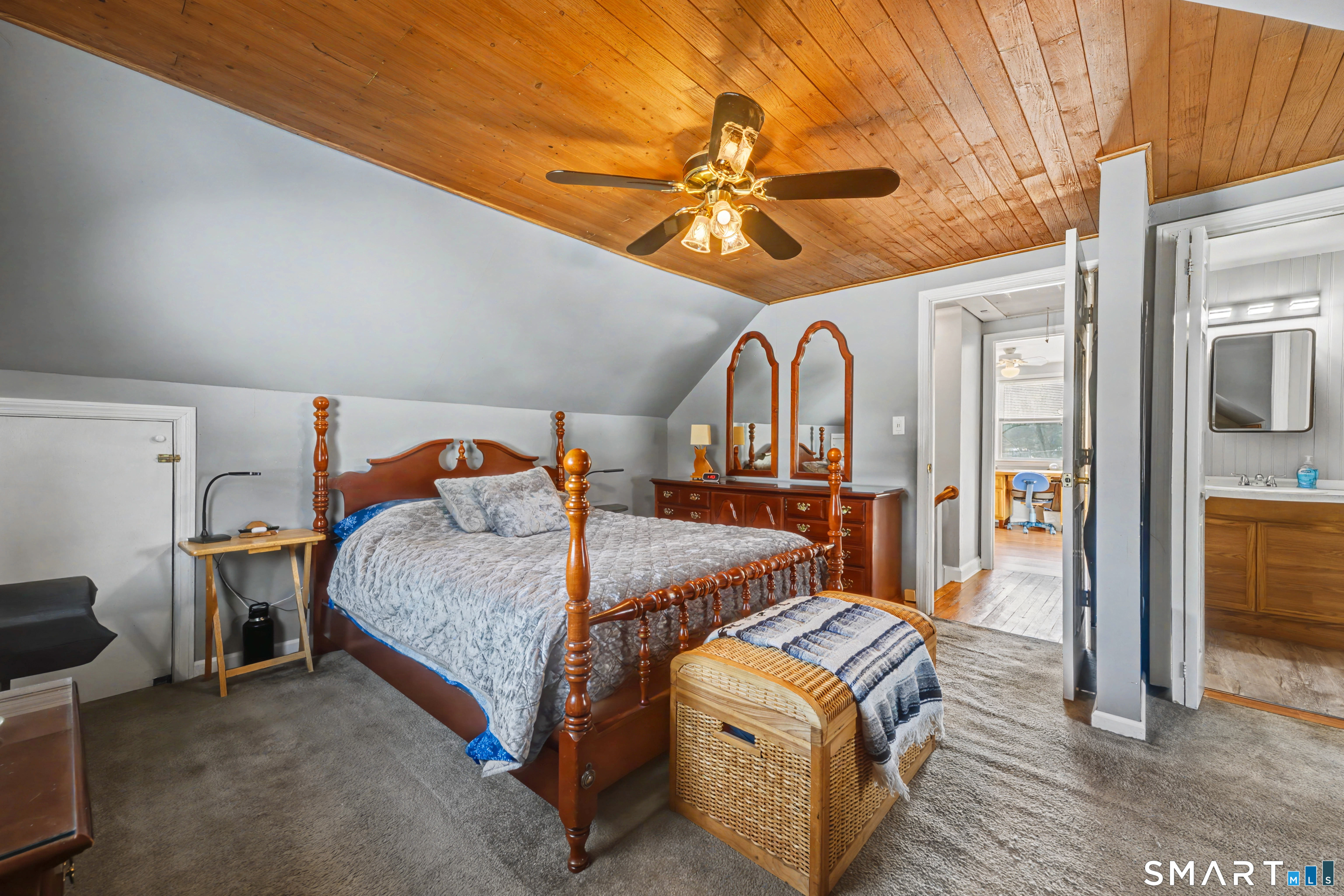 101 Pool Road North Haven, CT 06473 - Photo 24 of 37 a bed room with a bed and a chandelier