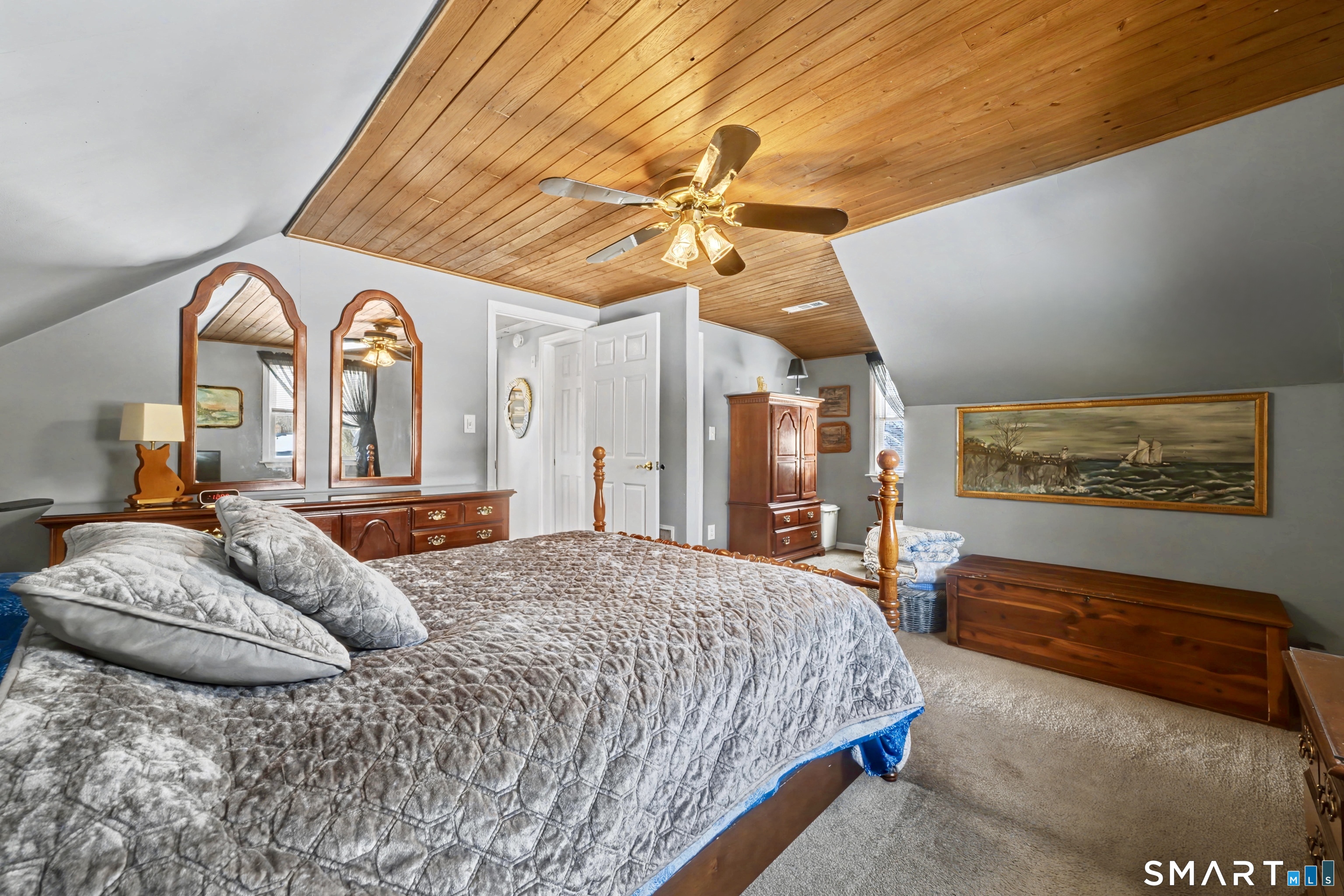 101 Pool Road North Haven, CT 06473 - Photo 25 of 37 a bedroom with a bed and a chandelier