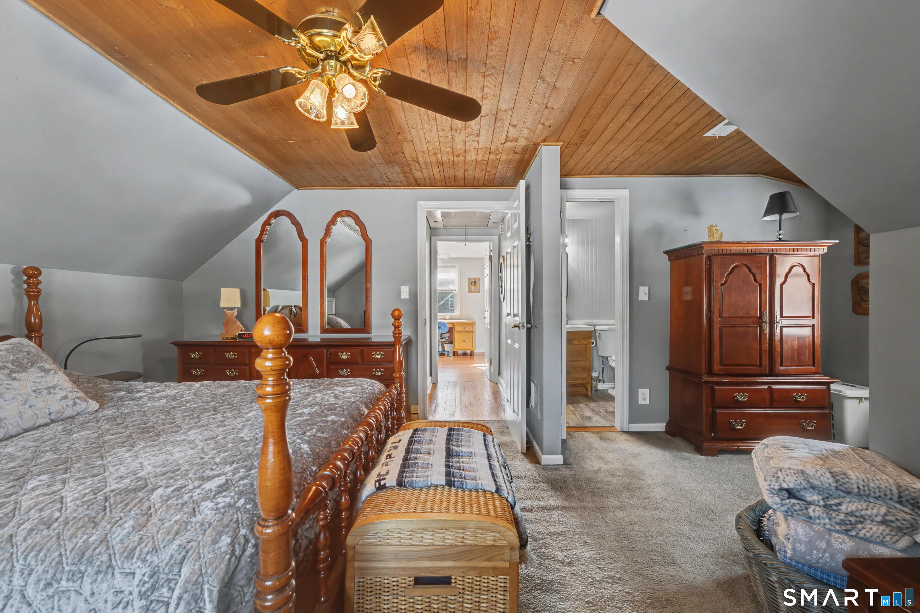 101 Pool Road North Haven, CT 06473 - Photo 27 of 37 a bedroom with a bed and a chandelier