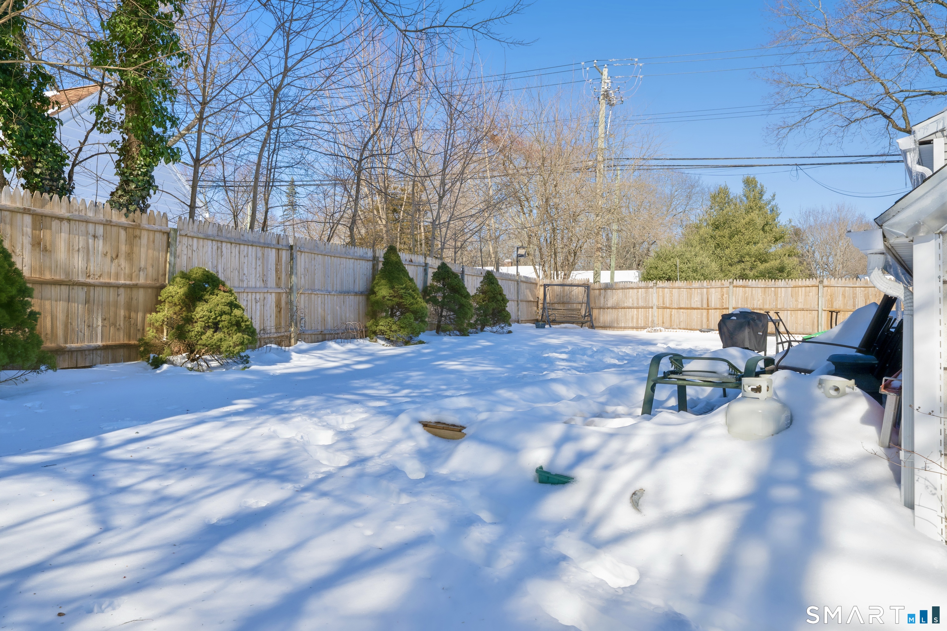 101 Pool Road North Haven, CT 06473 - Photo 33 of 37 a view of backyard with a table and chairs and potted plants