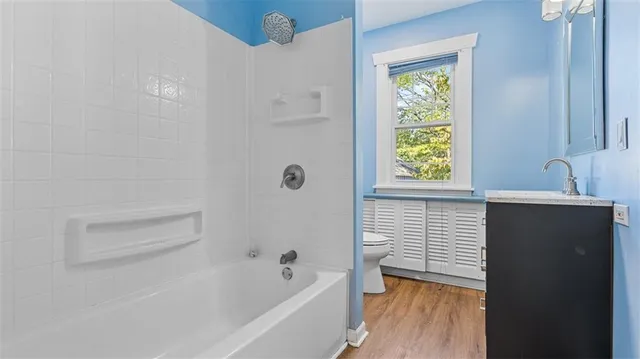 a bathroom with a bathtub and a sink