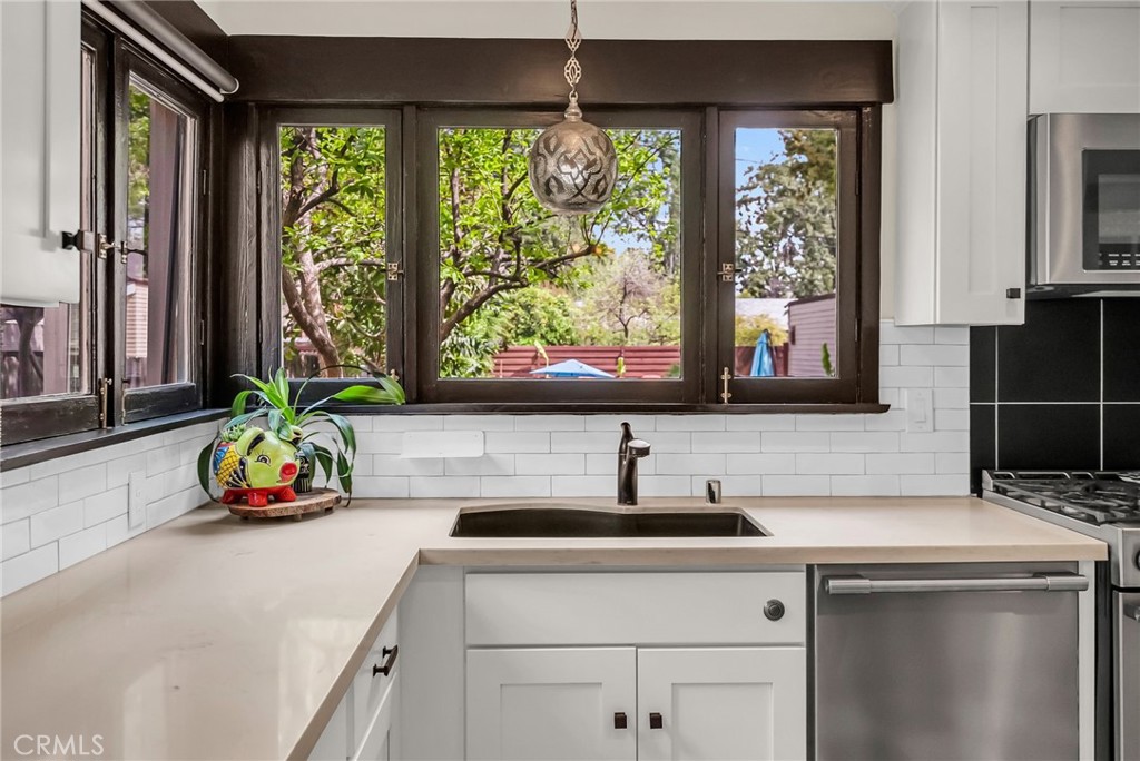 4465 5th Street Riverside, CA 92501 - Photo 17 of 56 a kitchen with a sink and a window