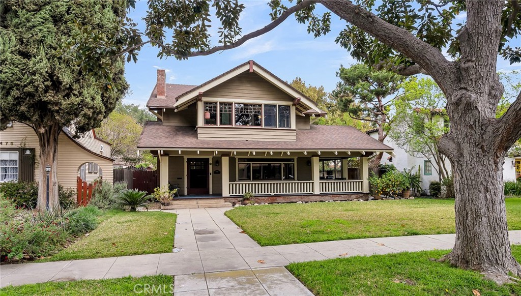 4465 5th Street Riverside, CA 92501 - Photo 2 of 56 a front view of a house with a yard and potted plants