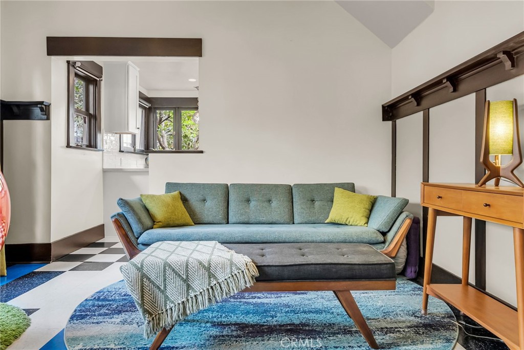 4465 5th Street Riverside, CA 92501 - Photo 22 of 56 a living room with a couch and a potted plant