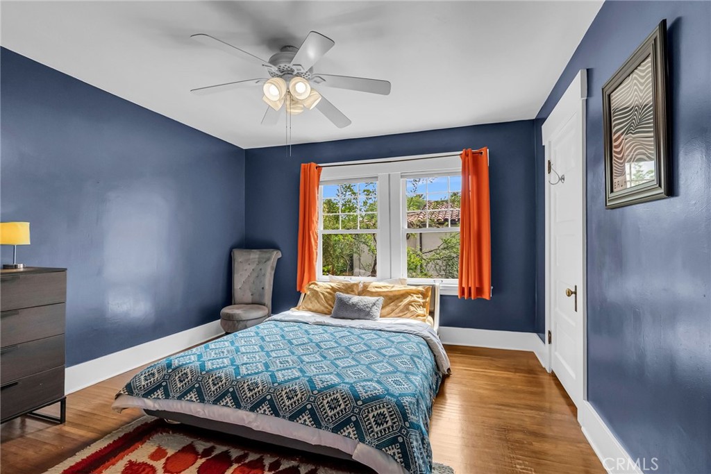 4465 5th Street Riverside, CA 92501 - Photo 25 of 56 a bedroom with a large bed and a large window