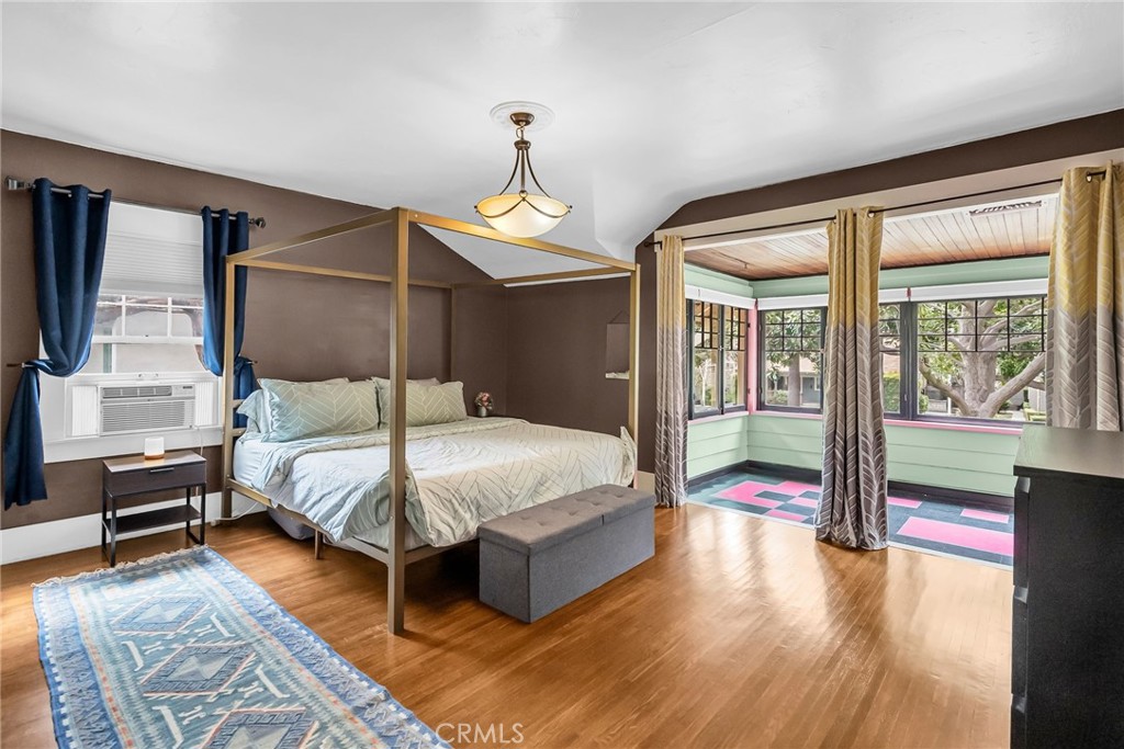 4465 5th Street Riverside, CA 92501 - Photo 27 of 56 a bedroom with a large bed and a chandelier