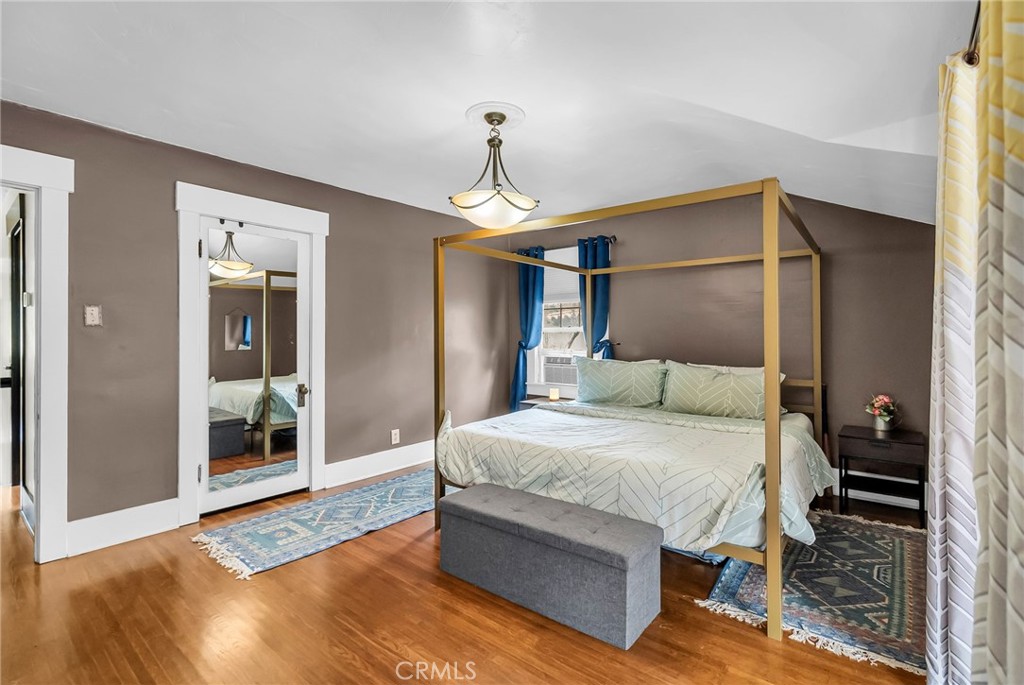 4465 5th Street Riverside, CA 92501 - Photo 29 of 56 a bedroom with bed and a chandelier