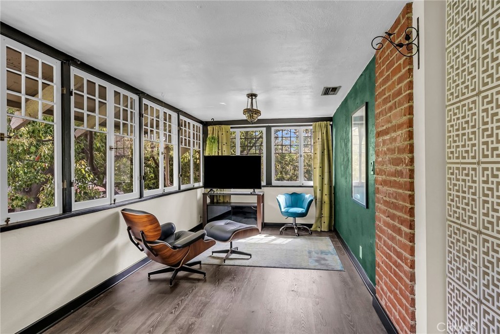 4465 5th Street Riverside, CA 92501 - Photo 31 of 56 a living room with furniture and a flat screen tv