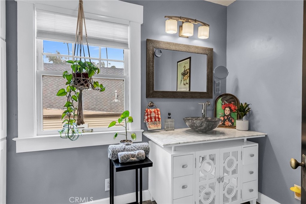 4465 5th Street Riverside, CA 92501 - Photo 34 of 56 a view of bathroom with a sink and a mirror