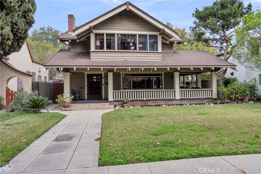 4465 5th Street Riverside, CA 92501 - Photo 4 of 56 a front view of a house with a garden