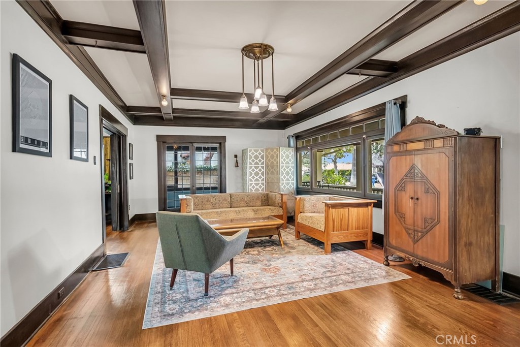4465 5th Street Riverside, CA 92501 - Photo 9 of 56 a living room with furniture a dining table and chairs with wooden floor
