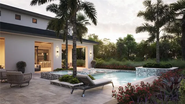 a front view of a house with garden and patio