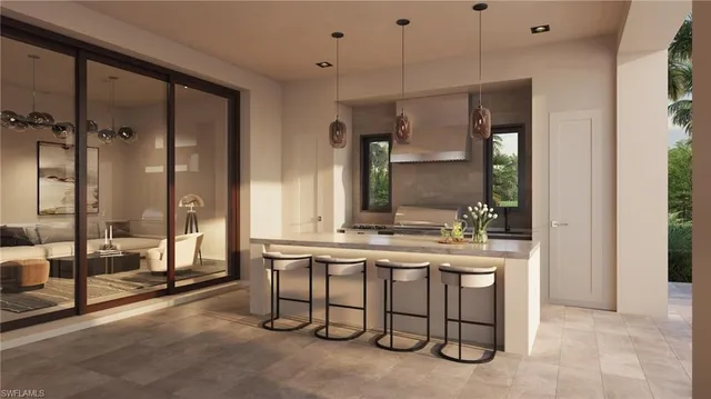 a kitchen with a sink and chairs