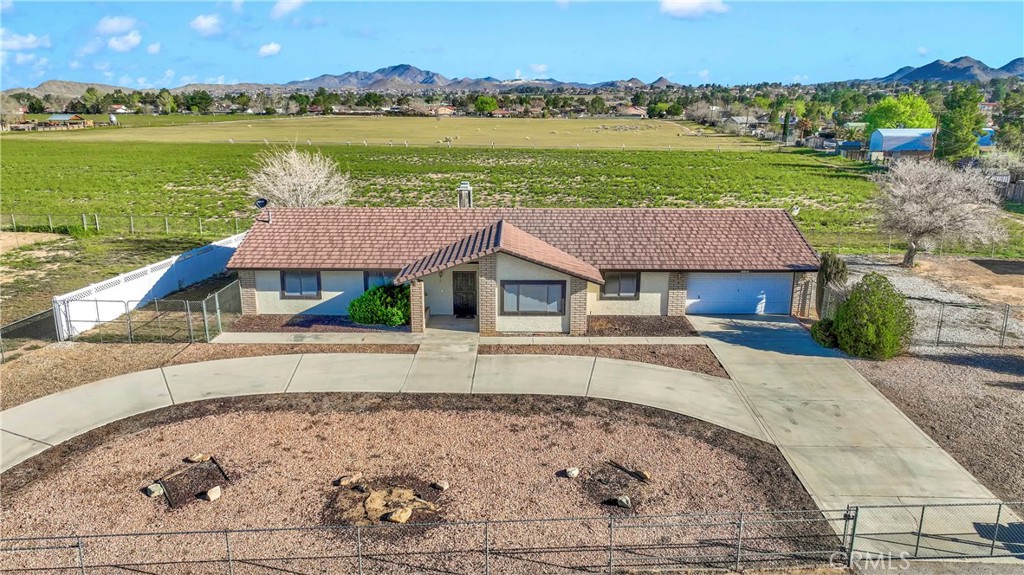 18876 Shoshonee Road Apple Valley, CA 92307 - Photo 1 of 1 an aerial view of a house with a ocean view