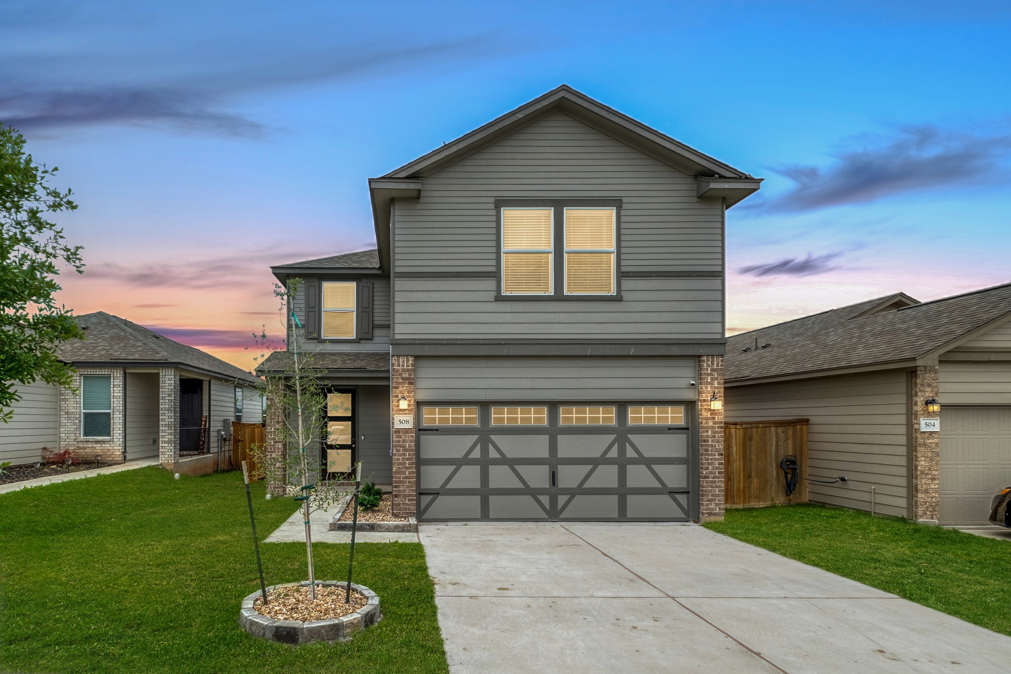 a front view of a house with a yard