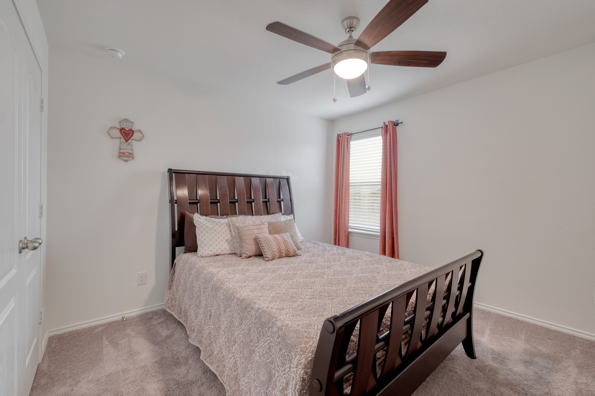 508 Barbary Coast Lane Jarrell, TX 76537 - Photo 20 of 27 a bedroom with a large bed and a chandelier