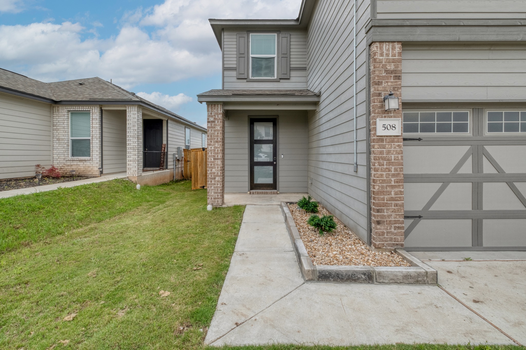508 Barbary Coast Lane Jarrell, TX 76537 - Photo 2 of 27 a front view of a house with garden