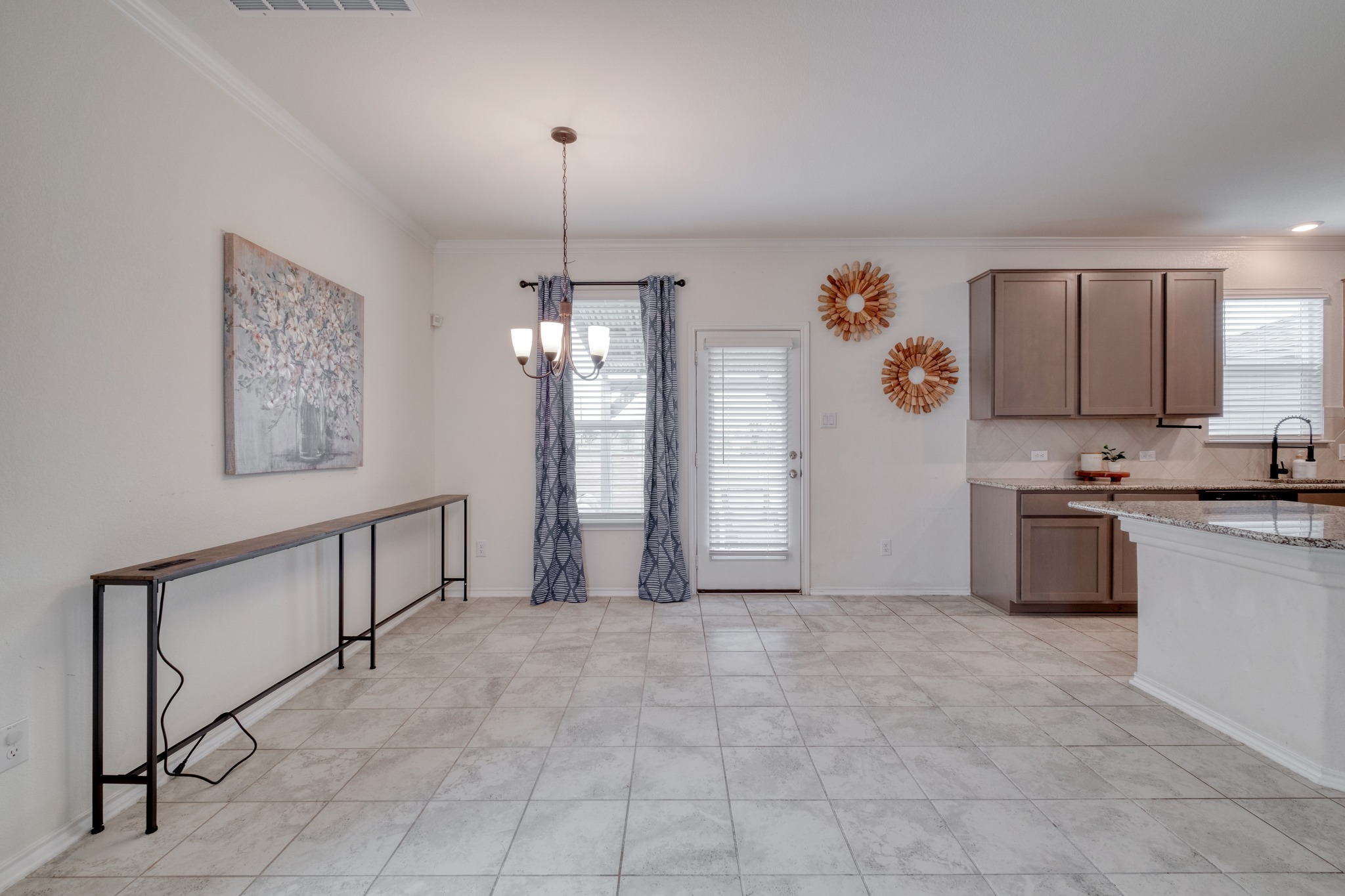 508 Barbary Coast Lane Jarrell, TX 76537 - Photo 5 of 27 a view of a kitchen with microwave and cabinets