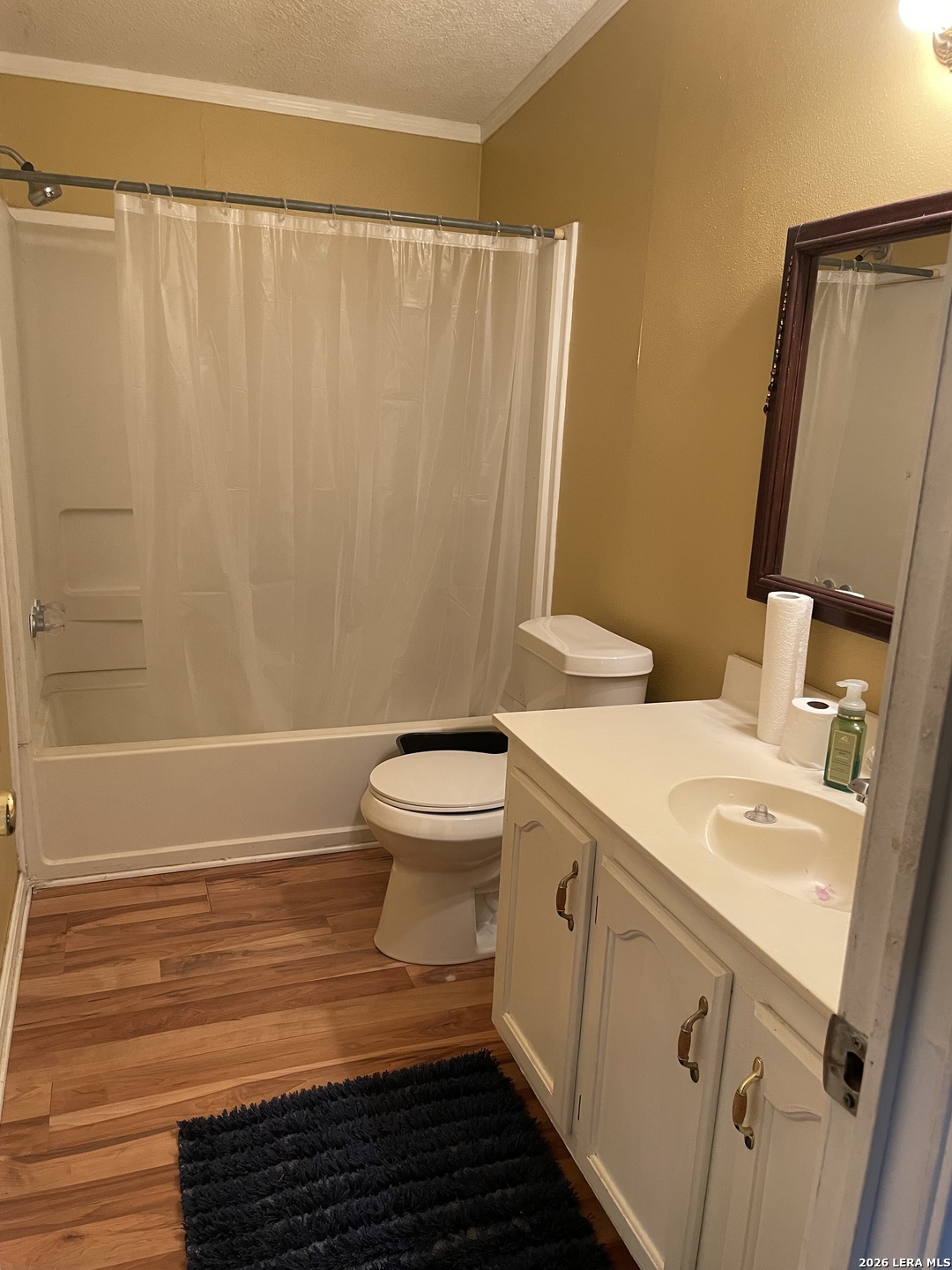 10280 Obrien Road Atascosa, TX 78002 - Photo 3 of 6 a bathroom with a sink a toilet and shower