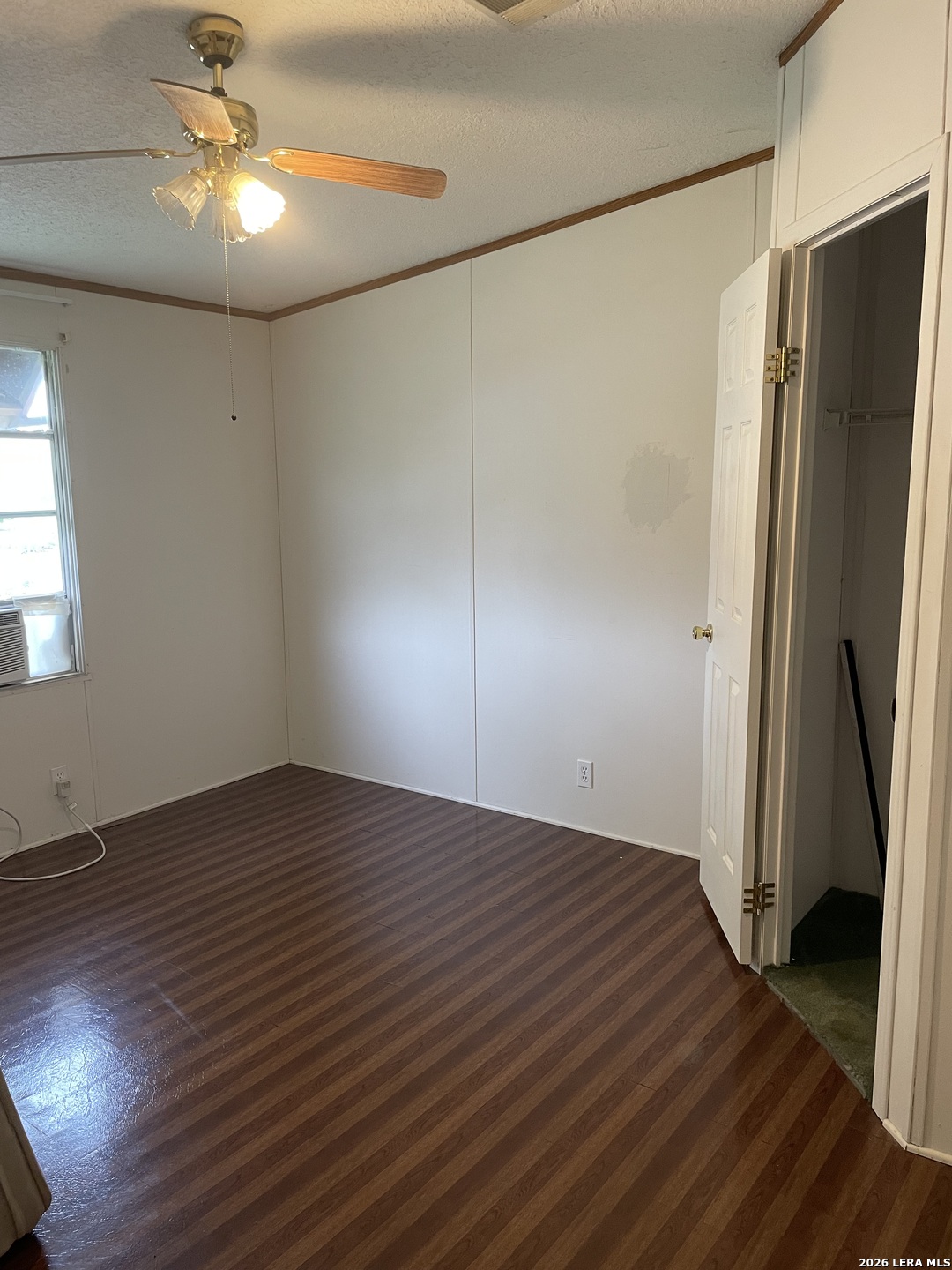 10280 Obrien Road Atascosa, TX 78002 - Photo 4 of 6 a view of empty room with wooden floor and fan
