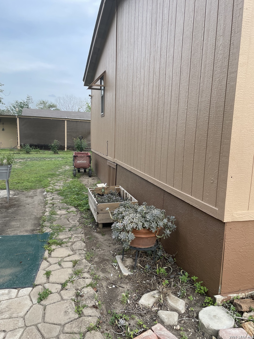 10280 Obrien Road Atascosa, TX 78002 - Photo 6 of 6 a view of a backyard with furniture and garden