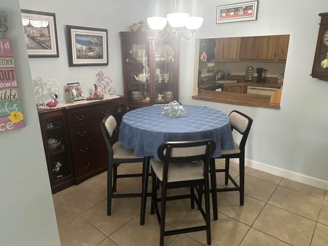 a dining room with a table and chairs