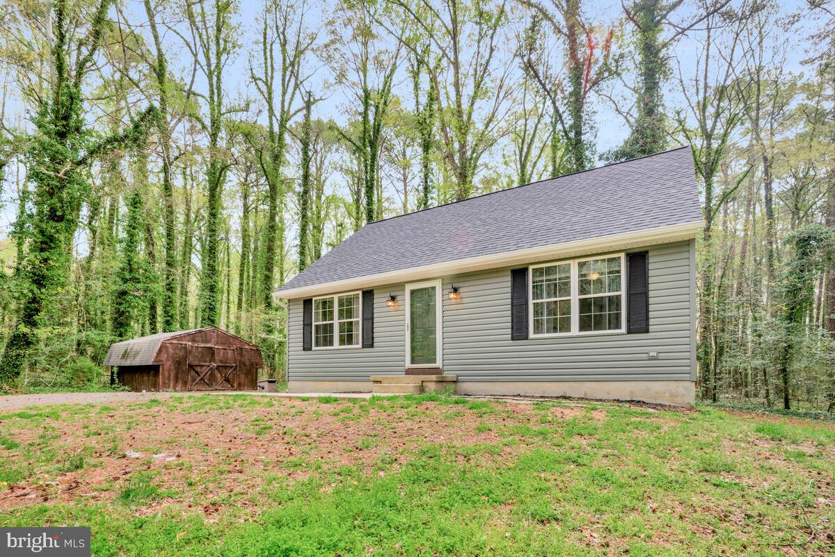 7800 Marshall Road St. Leonard, MD 20685 - Photo 3 of 29 a backyard of a house with seating space