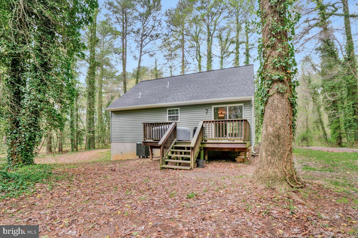 7800 Marshall Road St. Leonard, MD 20685 - Photo 5 of 29 a view of a house with a yard and wooden fence