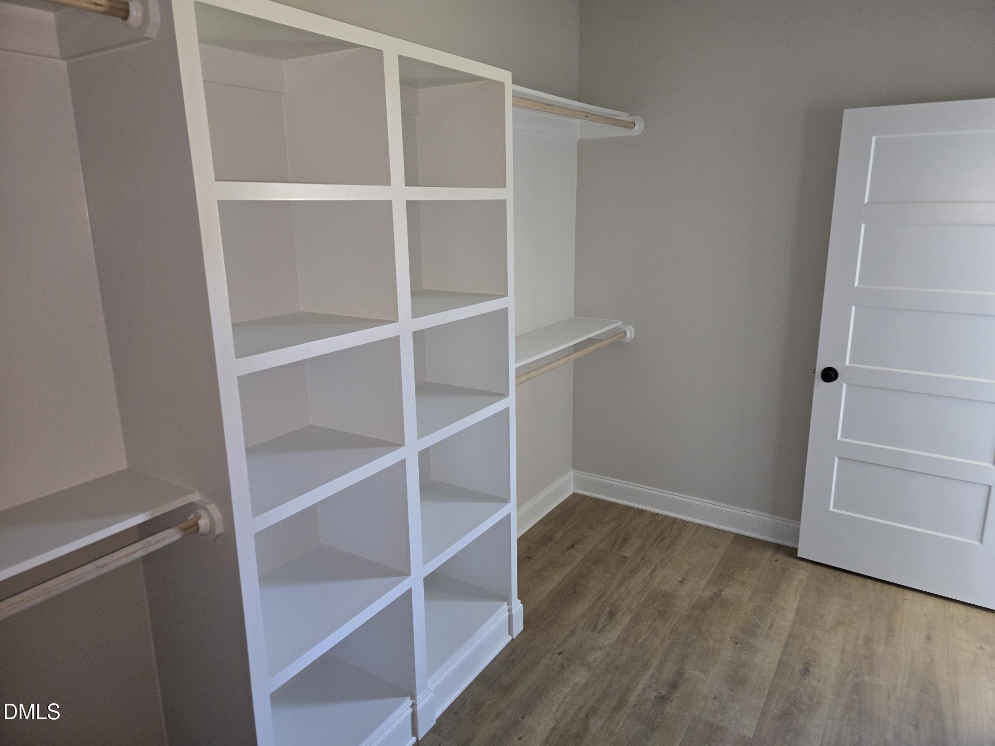 300 Avery Road Erwin, NC 28339 - Photo 31 of 38 a view of walk in closet with empty racks