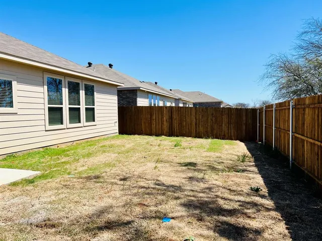 a house with yard in front of it