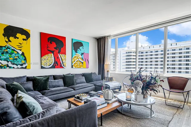 a living room with furniture fireplace and flat screen tv