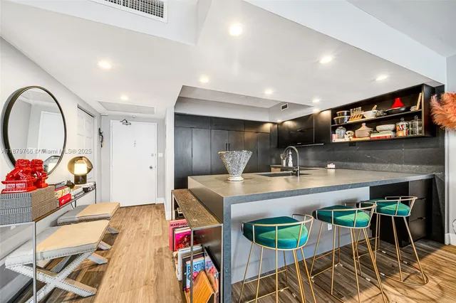 a living room with lots of furniture and a chandelier