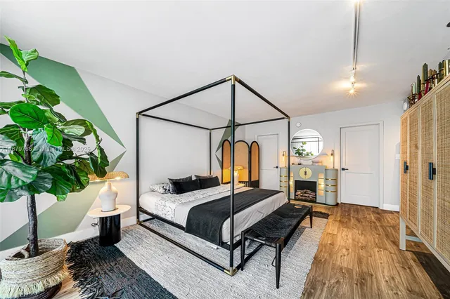 a view of a swimming pool with a table and chairs