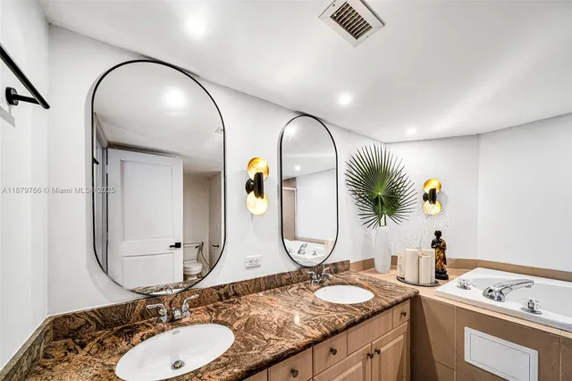 a front view of a building with a lake view