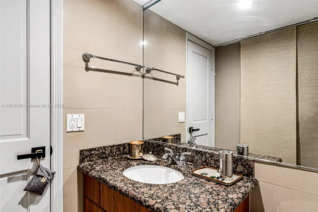 a living room with fireplace furniture and a chandelier