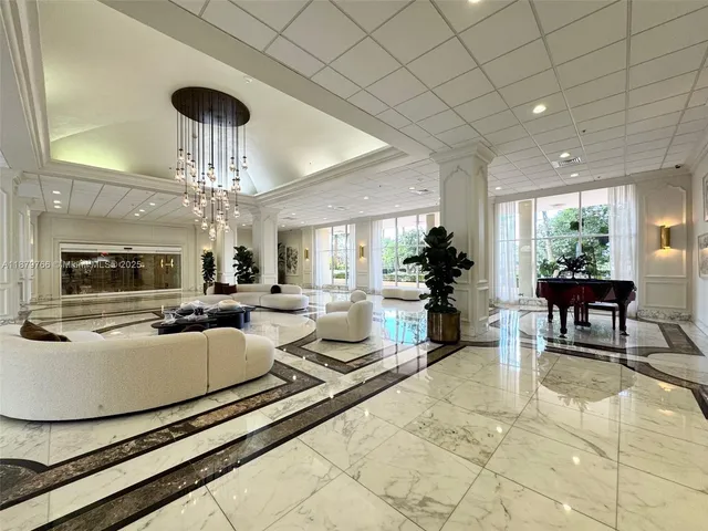a view of a patio with table and chairs under an umbrella