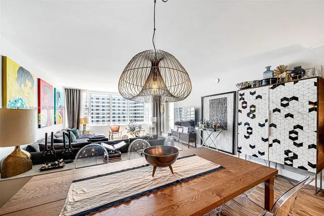 a kitchen with stainless steel appliances granite countertop a sink and a refrigerator