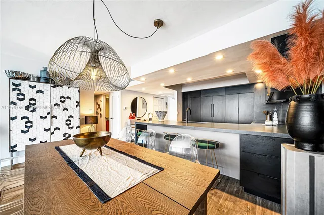 a living room with furniture a rug and a wooden floor