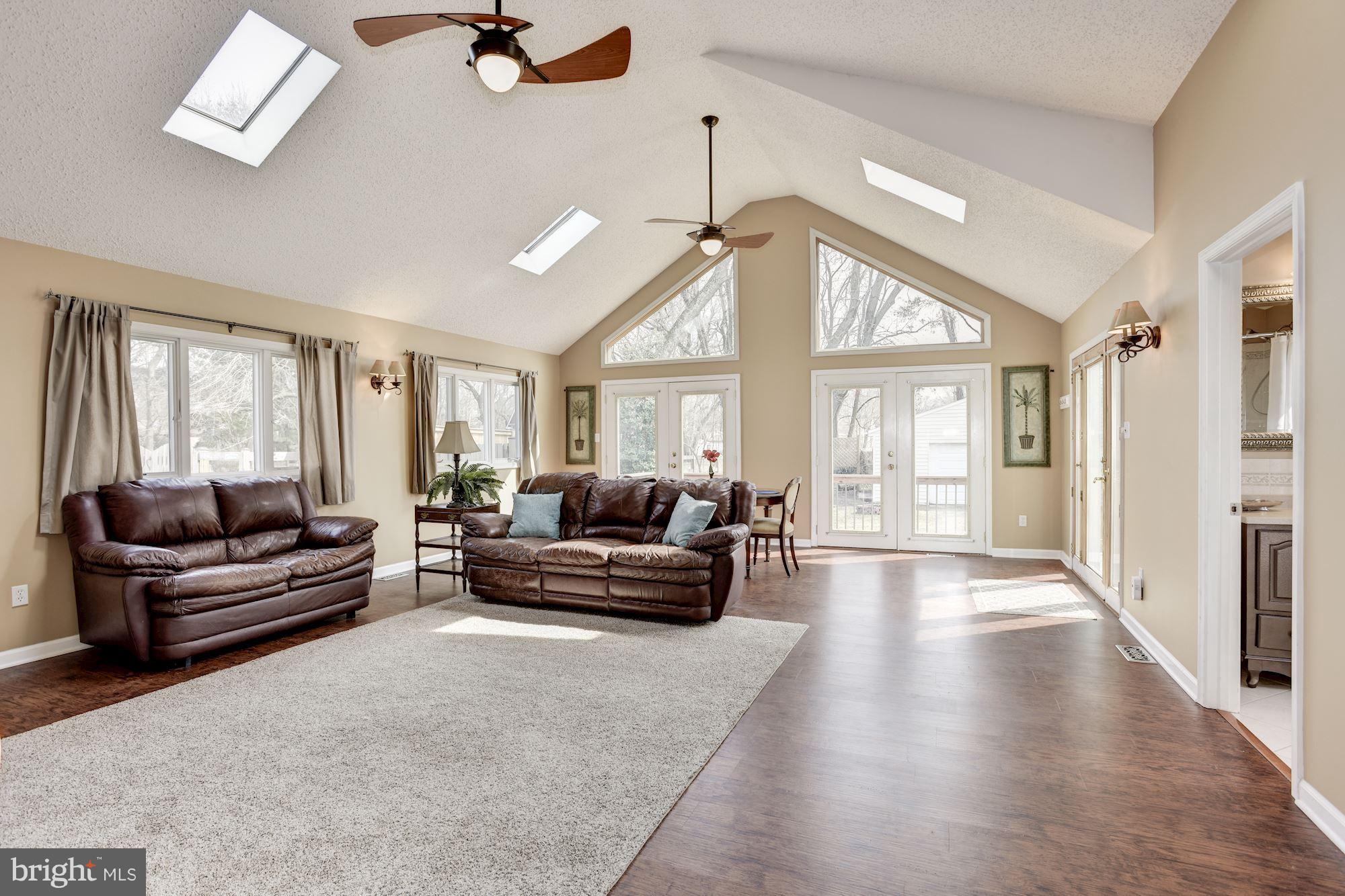 265 Pertch Road Severna Park, MD 21146 - Photo 12 of 30 Living room feat. 3 sets of French doors to deck