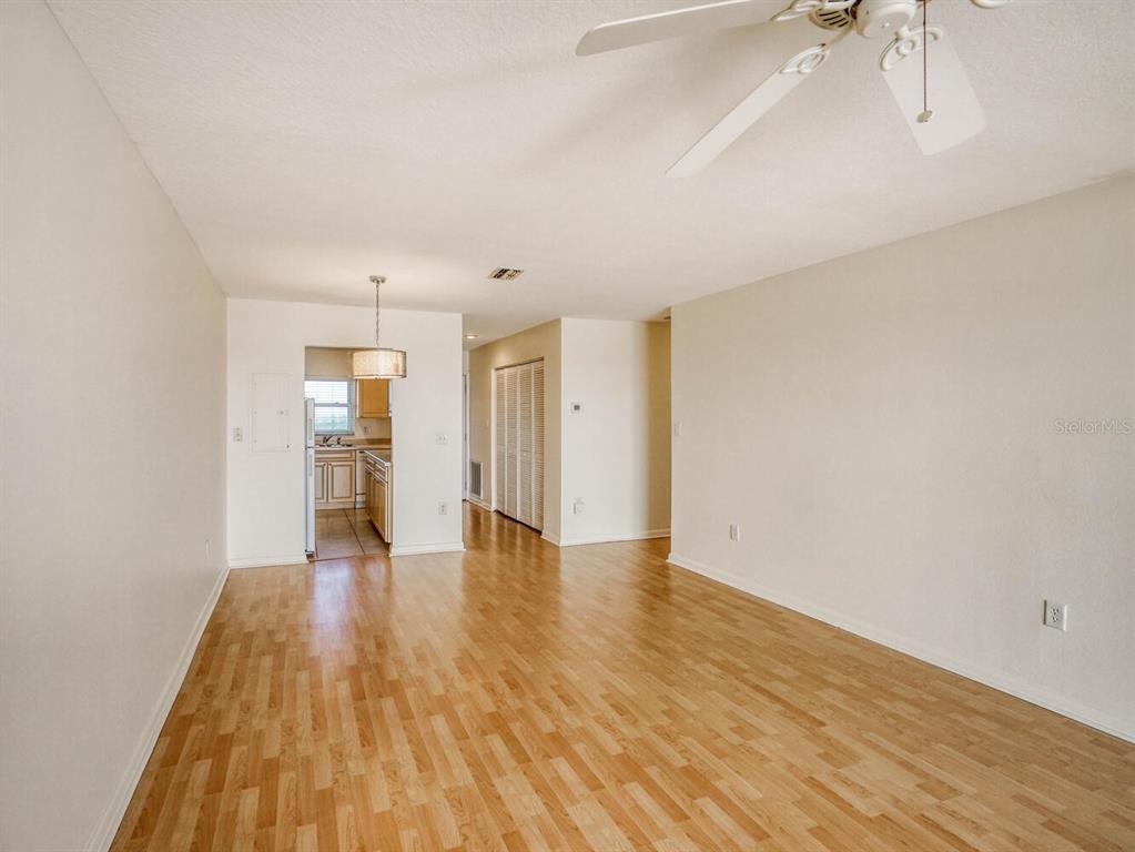 4939 Floramar Terrace, Unit 904 New Port Richey, FL 34652 - Photo 12 of 53 a view of empty room with wooden floor