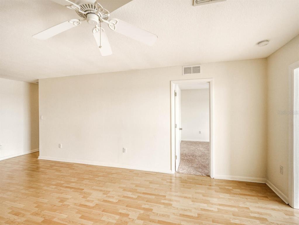 4939 Floramar Terrace, Unit 904 New Port Richey, FL 34652 - Photo 22 of 53 wooden floor in an empty room