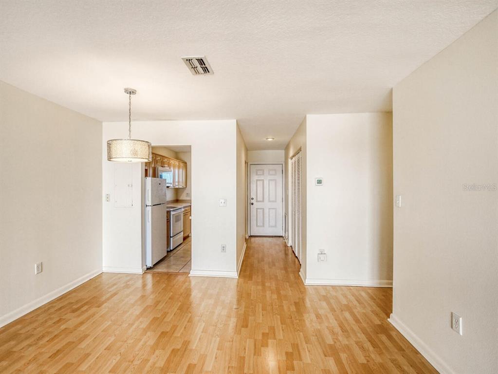 4939 Floramar Terrace, Unit 904 New Port Richey, FL 34652 - Photo 28 of 53 a view of a room with wooden floor