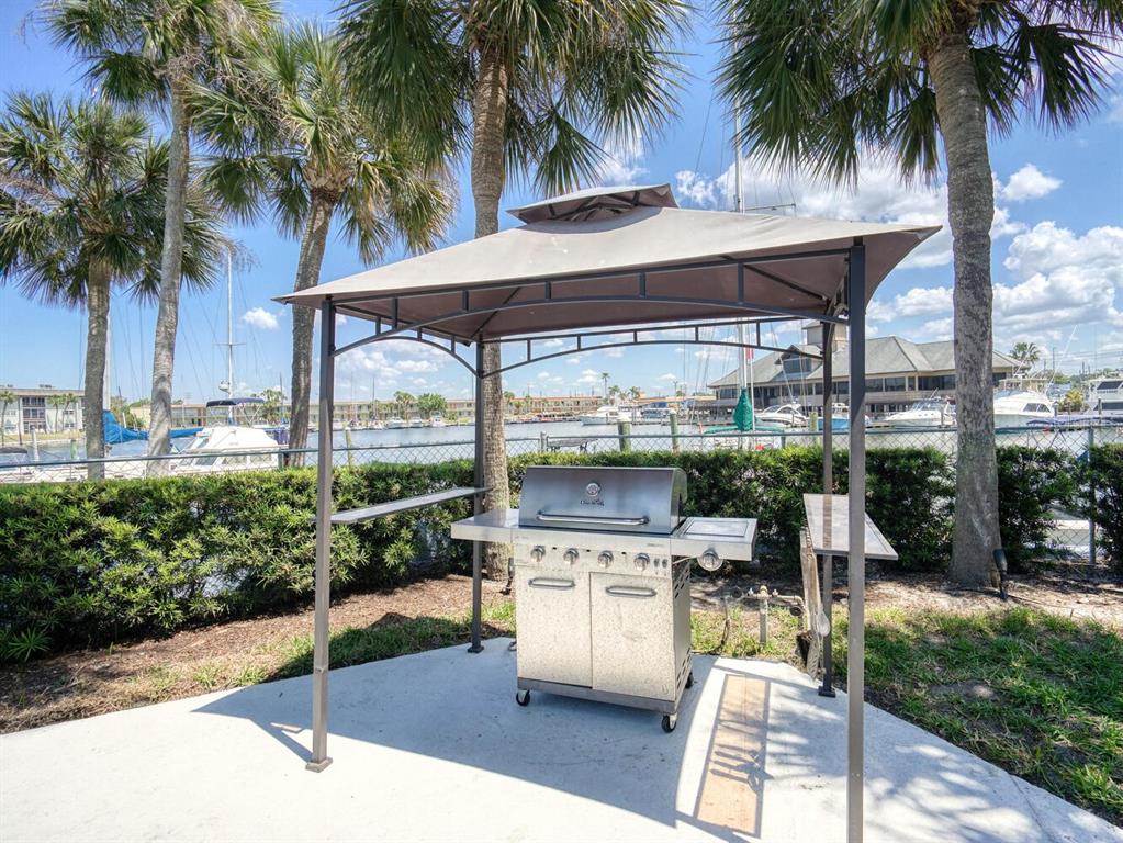 4939 Floramar Terrace, Unit 904 New Port Richey, FL 34652 - Photo 41 of 53 a view of a backyard and swimming pool