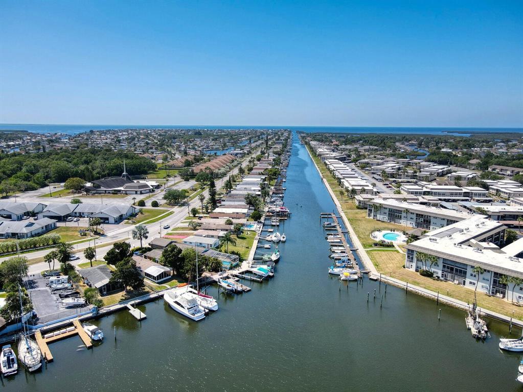 4939 Floramar Terrace, Unit 904 New Port Richey, FL 34652 - Photo 48 of 53 an aerial view of residential houses with outdoor space
