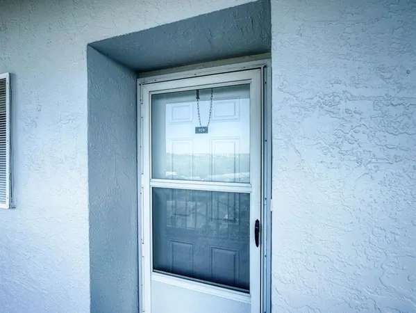 a bathroom with a shower and a sink