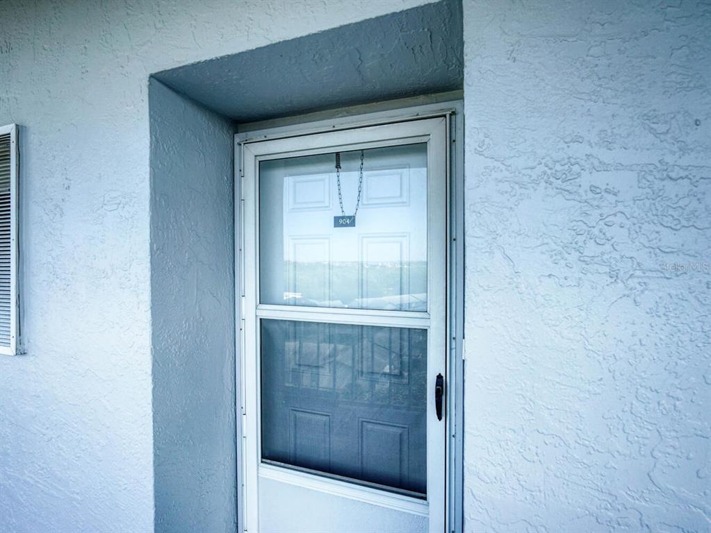 4939 Floramar Terrace, Unit 904 New Port Richey, FL 34652 - Photo 5 of 53 a bathroom with a shower and a sink
