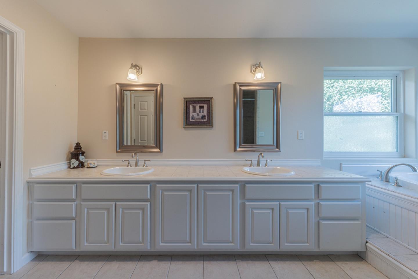 2188 Ridge Rider Road Bradley, CA 93426 - Photo 32 of 47 a bathroom with a double vanity sink and mirror