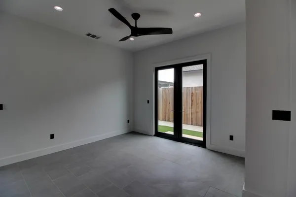 a view of an empty room with a window