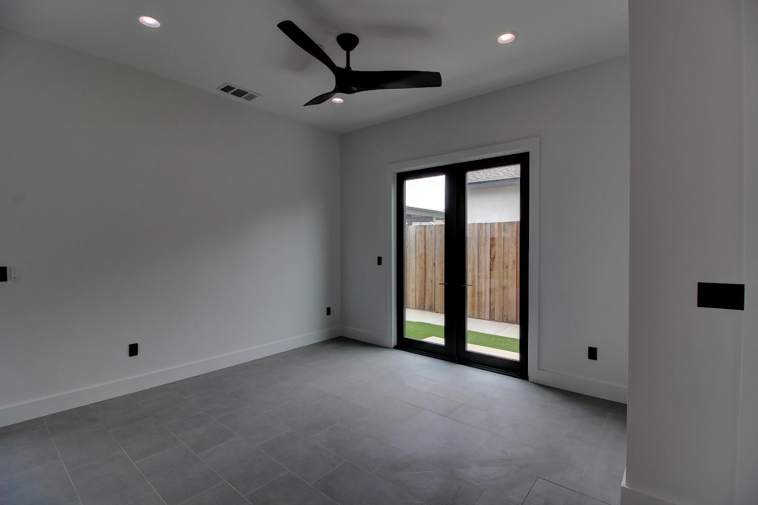 1526 3rd Street Escalon, CA 95320 - Photo 16 of 44 a view of an empty room with a window